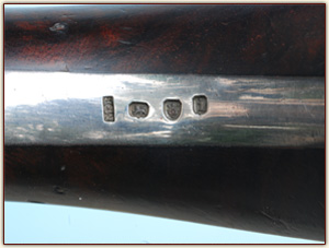 Silver hallmarks on pistol